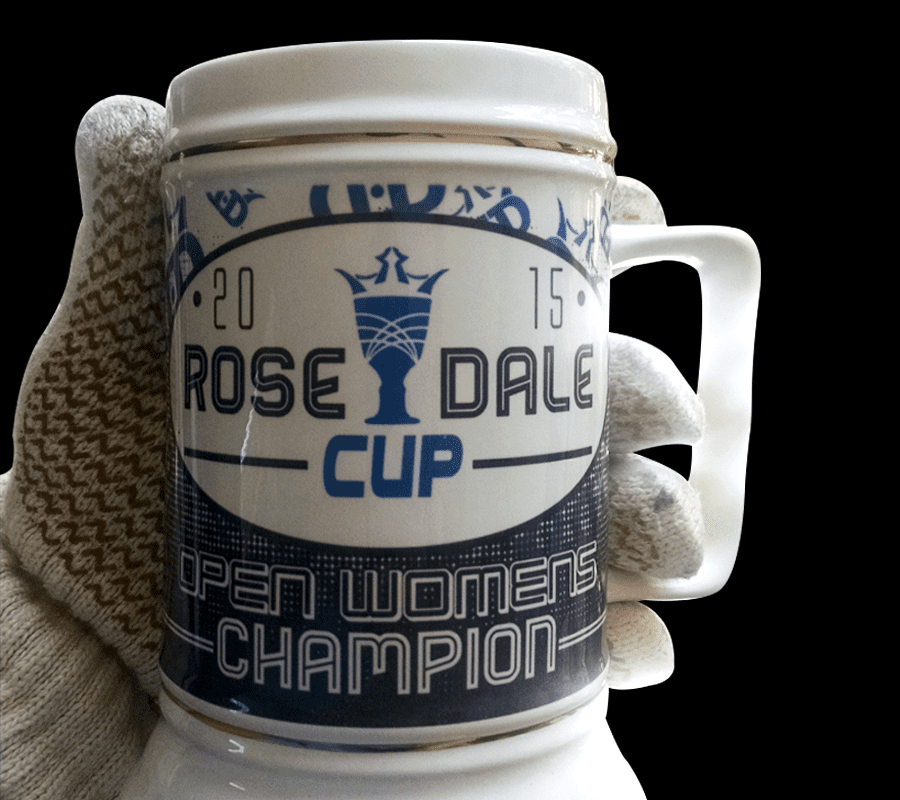 A close up of a cup with the words " rose dale cup open women 's champion ".