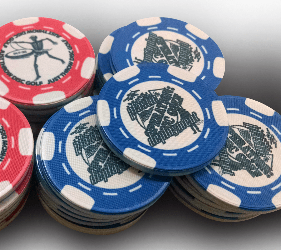 A pile of poker chips sitting on top of each other.