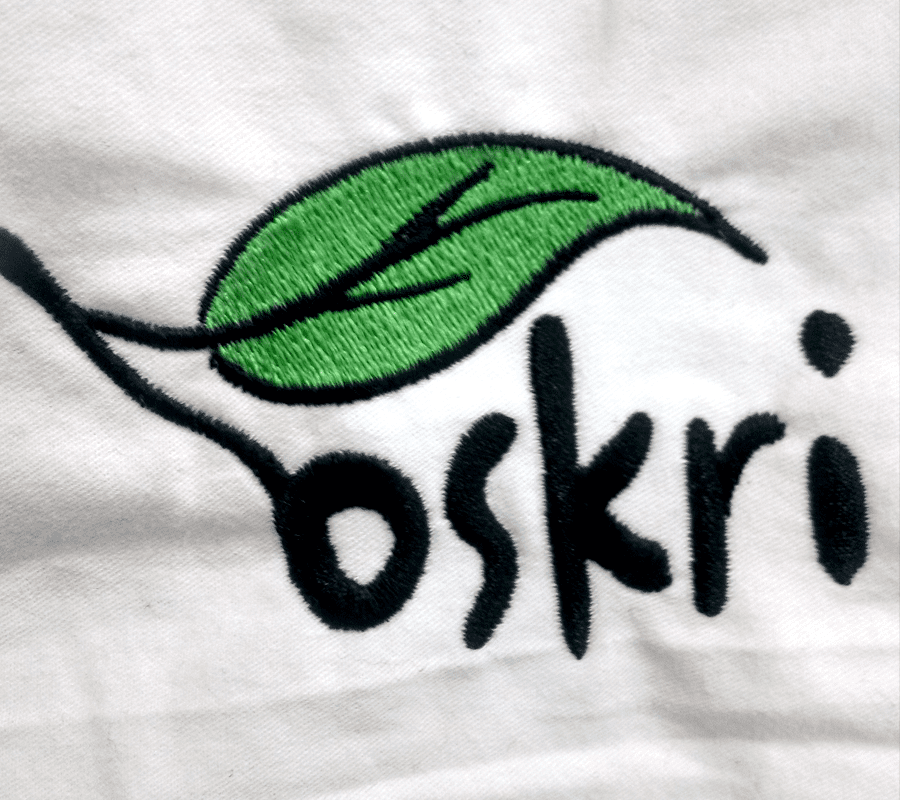 A close up of the logo for oskri